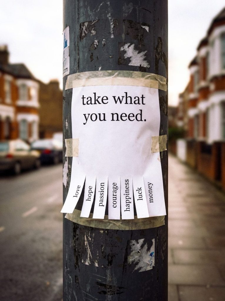 Photo by Maximus Mazar A sign on a pole reads 'take what you need.'